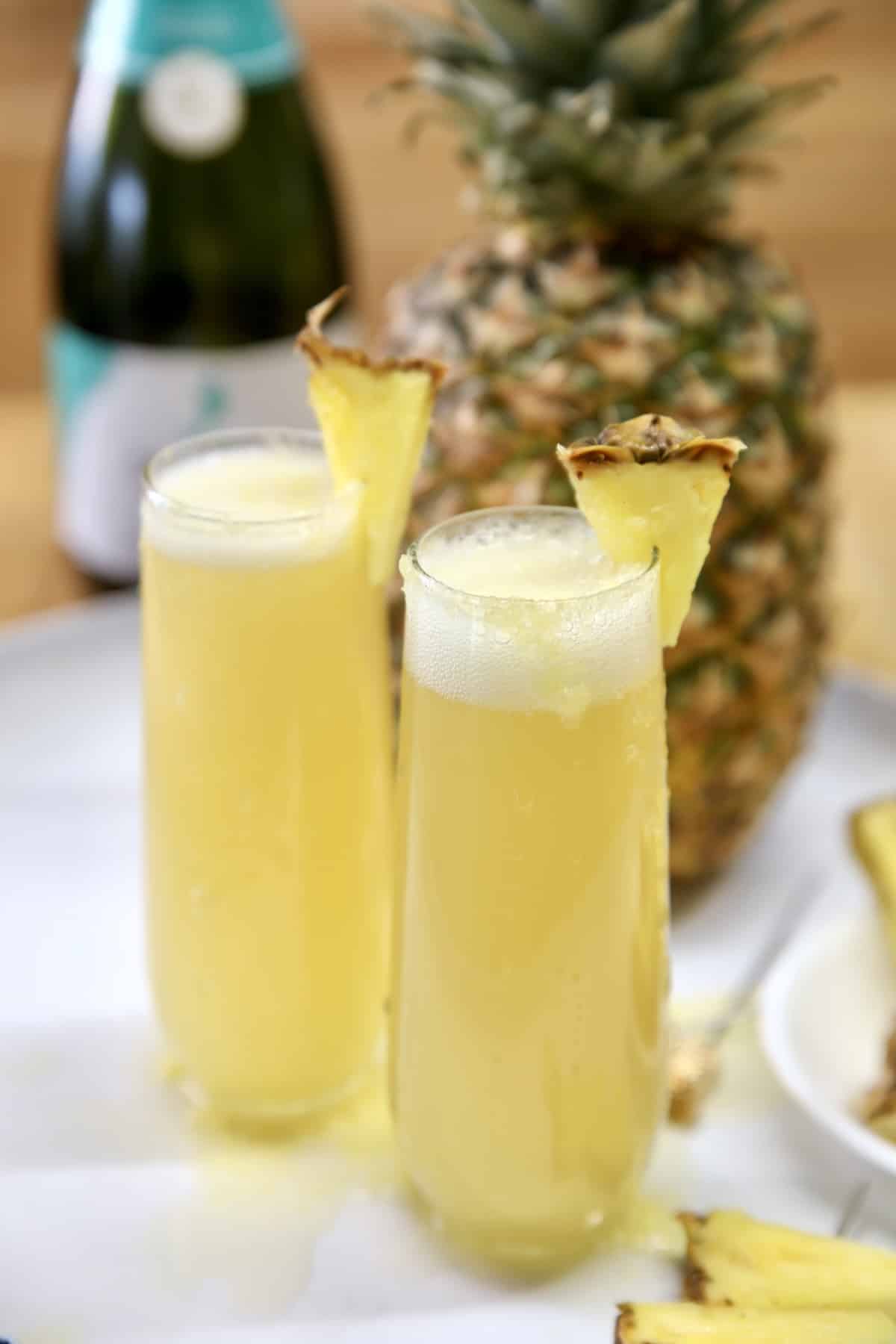 https://www.missinthekitchen.com/wp-content/uploads/2016/05/Pineapple-Mimosa-Cocktail-Image.jpg