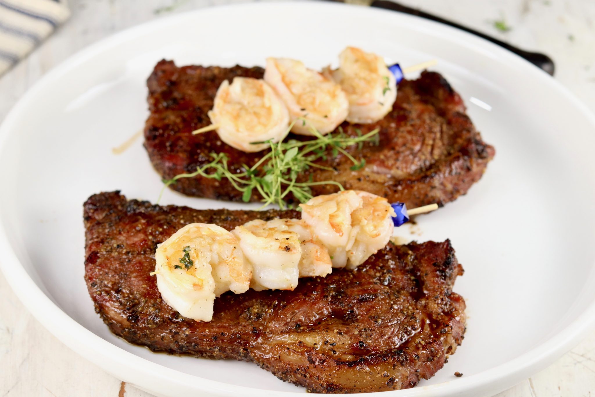 Grilled Garlic Butter Steak & Shrimp - Over The Fire Cooking