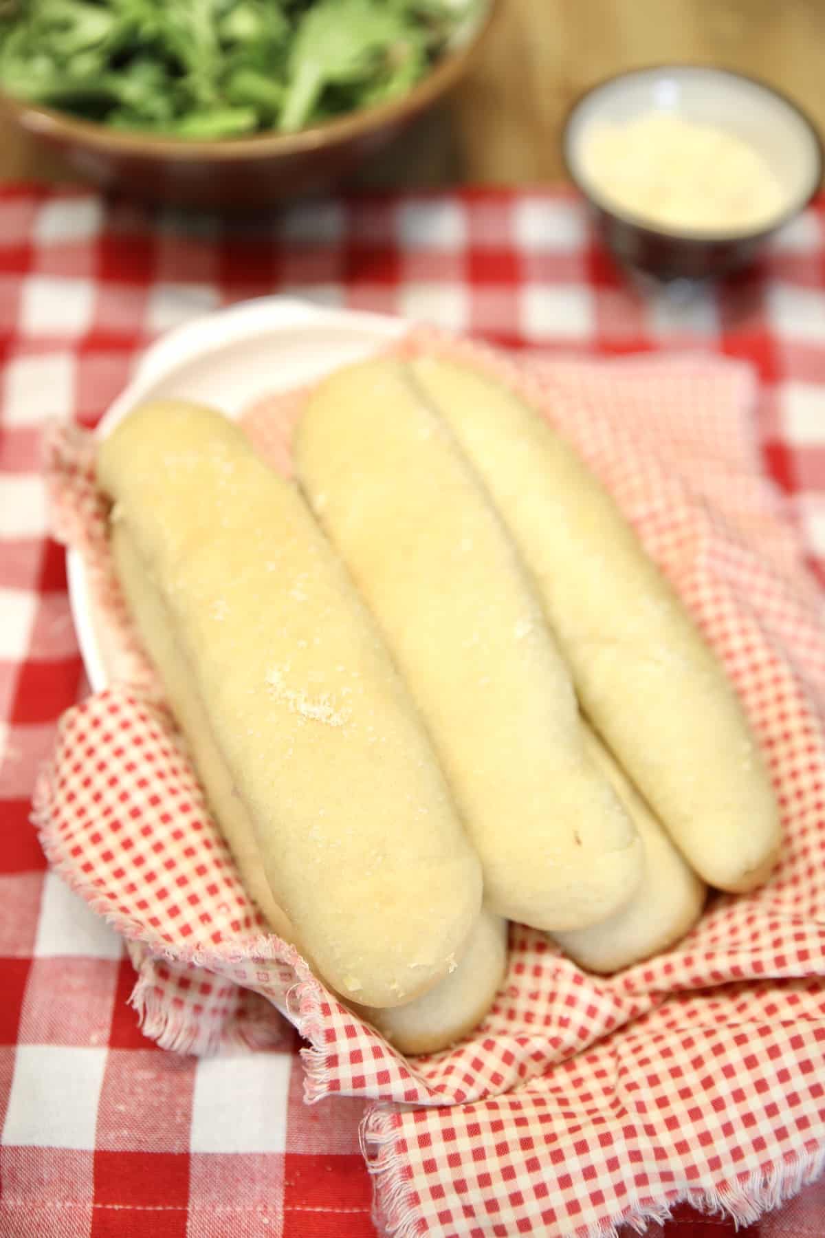 Breadsticks with salad.