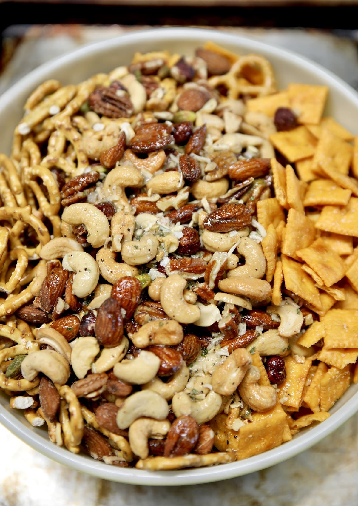 Cheese cracker snack mix in a bowl with seasoning mix.