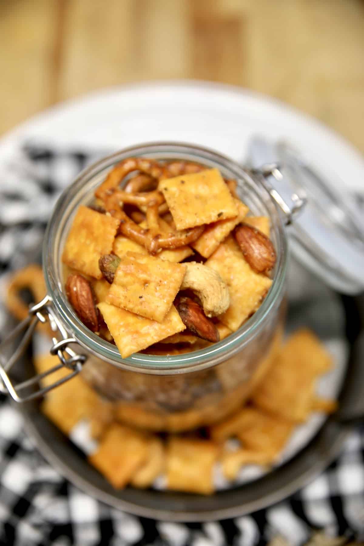 Jar of pretzel and cracker snack mix.