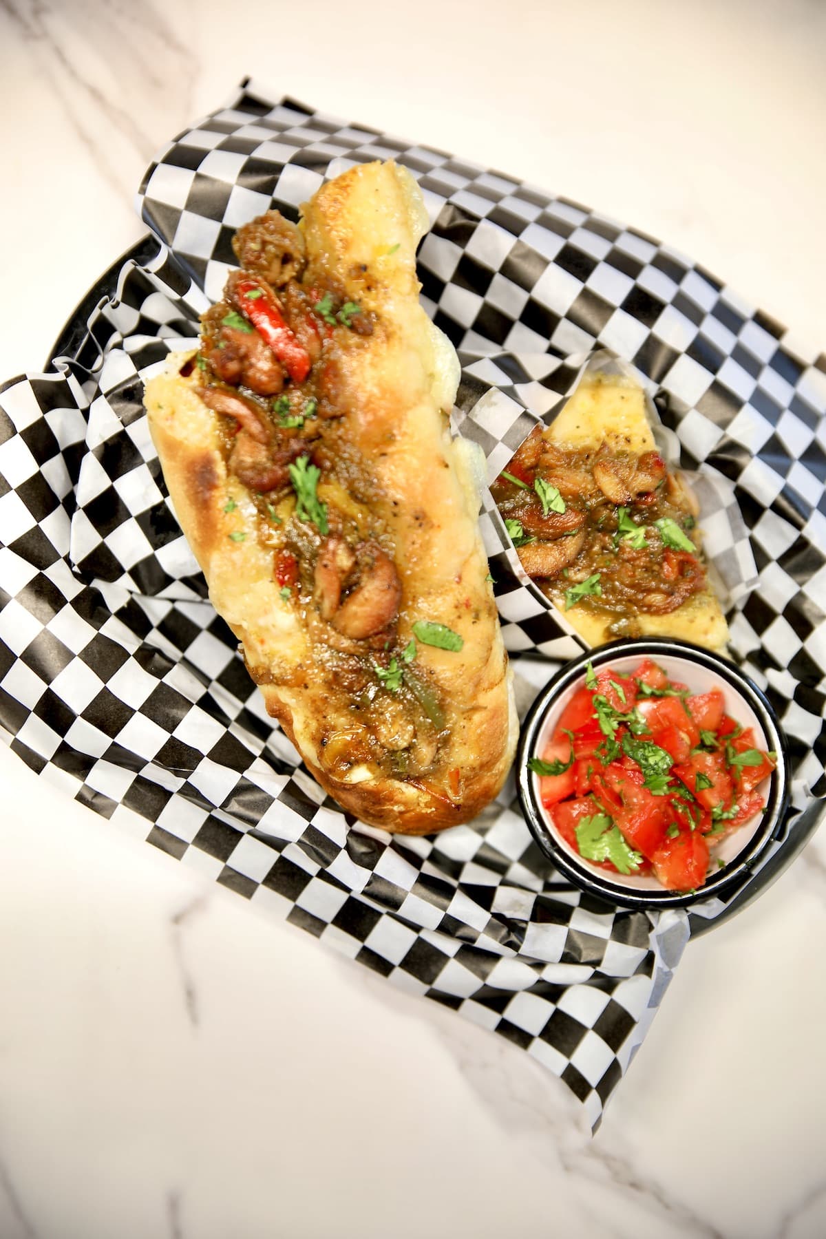 Basket with chicken fajita toasted sandwich.