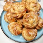 Peach Pie Cruffins on a plate.