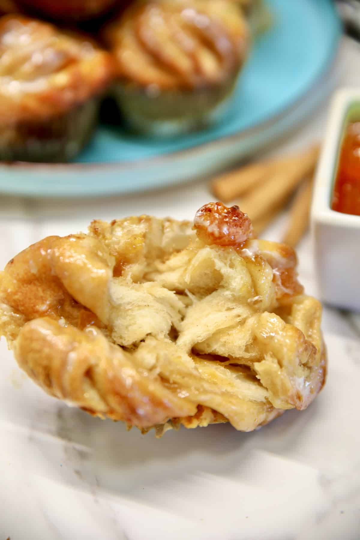 Peach cruffin split open to show layers.