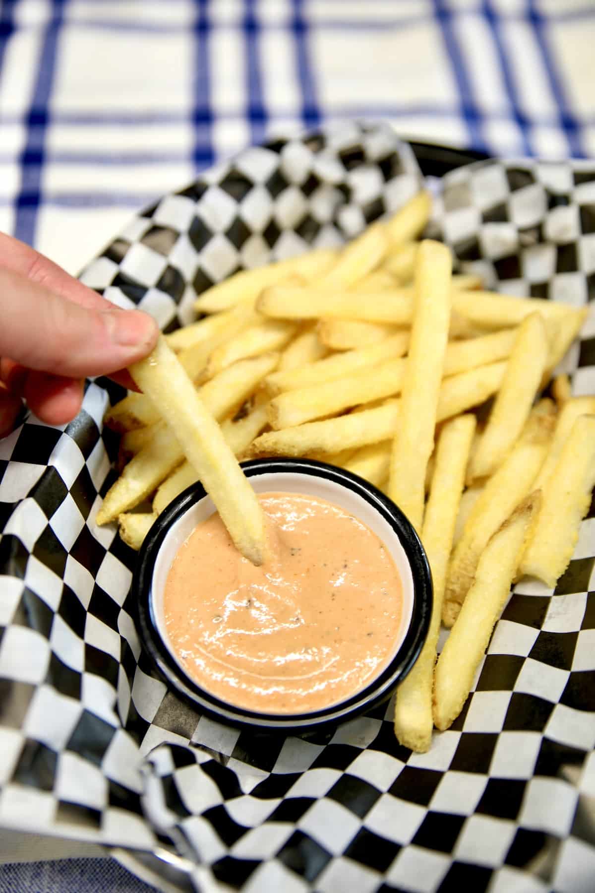 Fry sauce with french fry dipping in the cup.