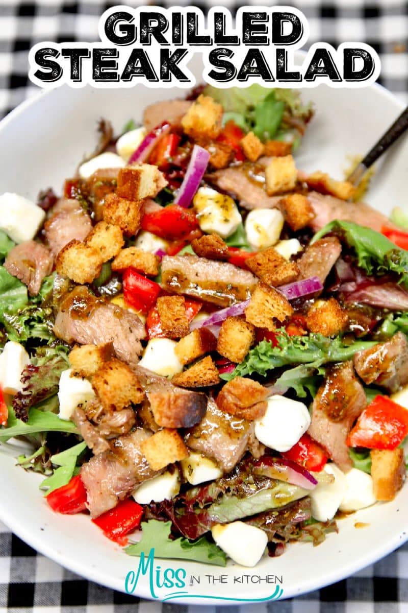 Grilled Steak salad in a bowl - text overlay.