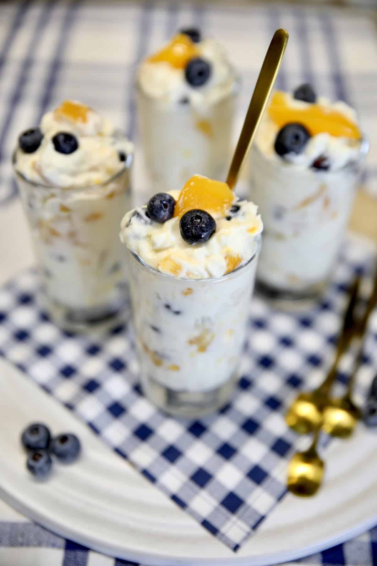 Cheesecake fluff salad with blueberries and peaches. 