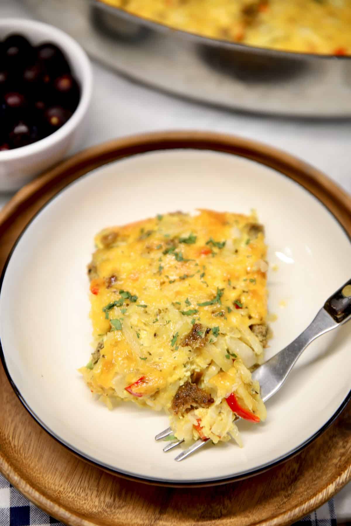 Hashbrown casserole with sausage on a plate.