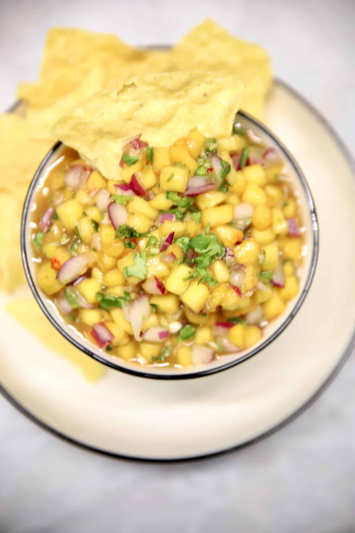 Peach salsa with tortilla chips.