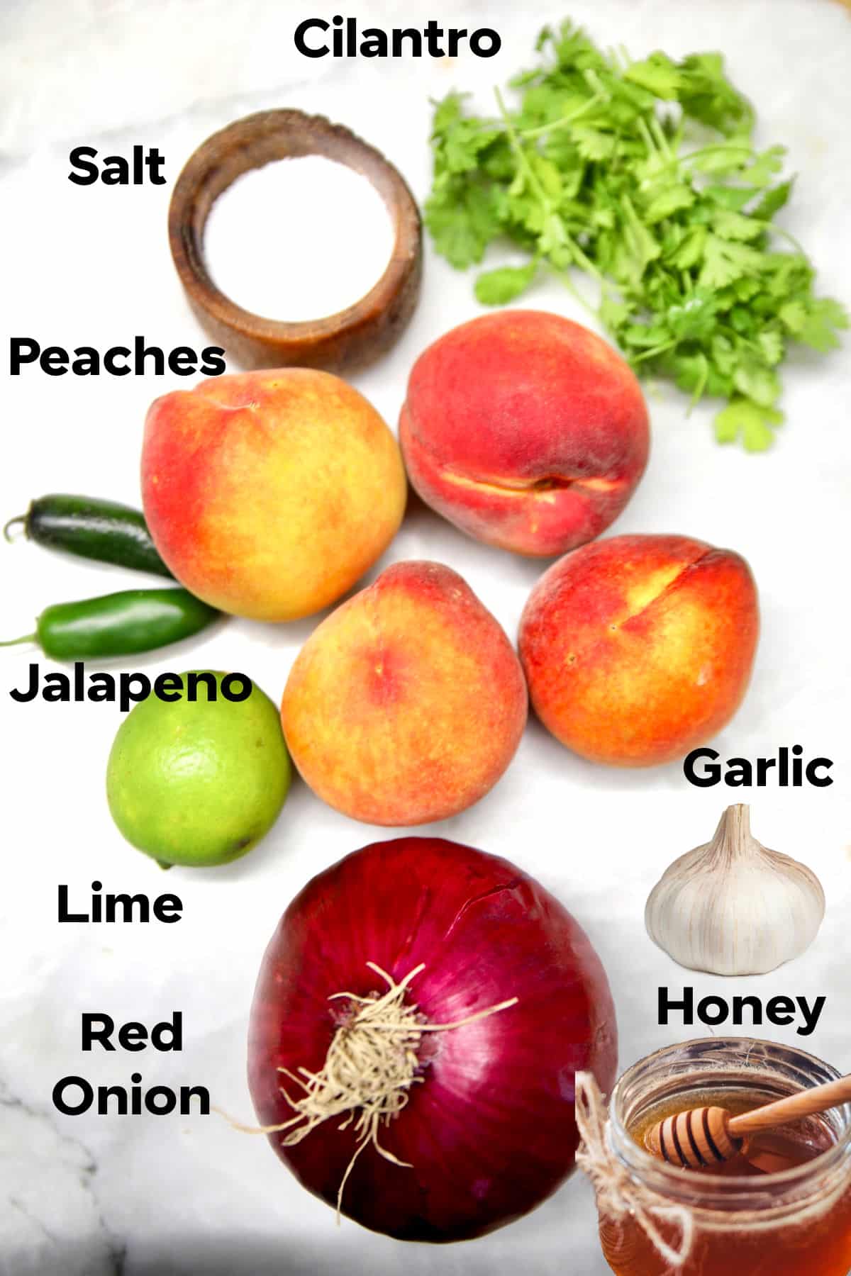 Ingredients for fresh peach salsa recipe with text labels.