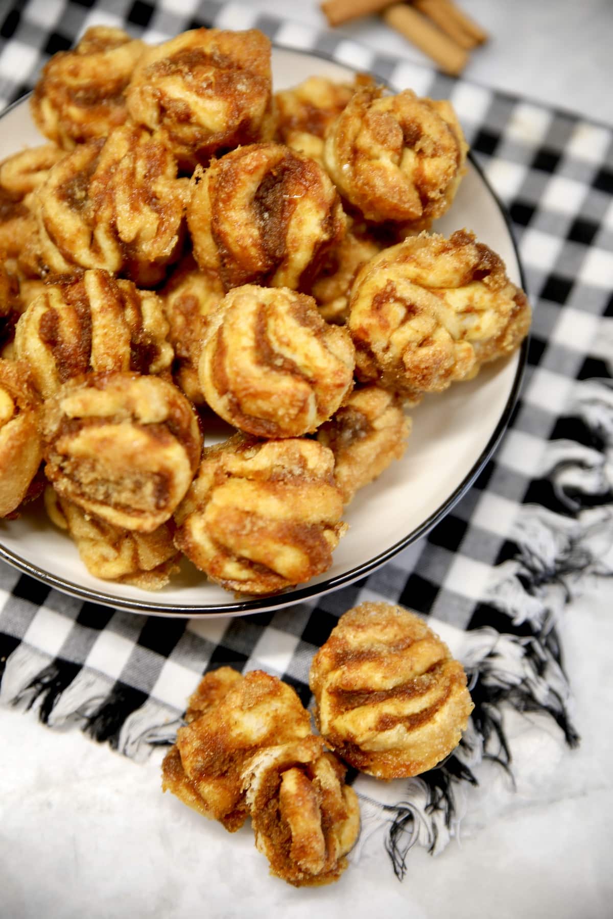 Pumpkin cruffins on a plate, 2 on a napkin.