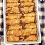 Pumpkin crescent dumplings in a baking pan.