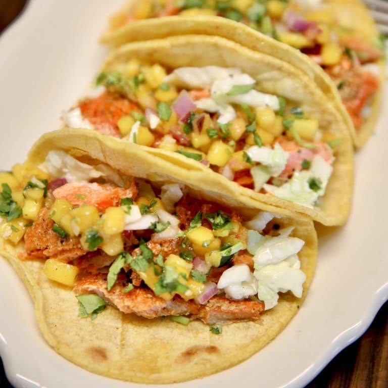 Salmon tacos on a platter.