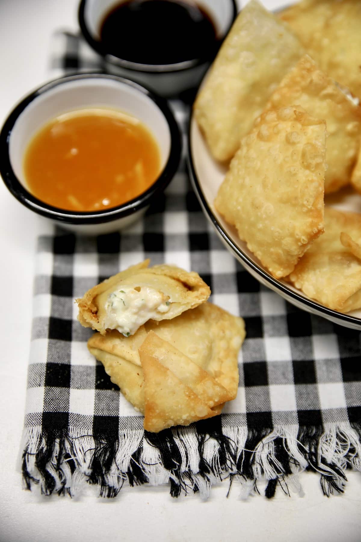 Shrimp rangoon with orange dipping sauce.