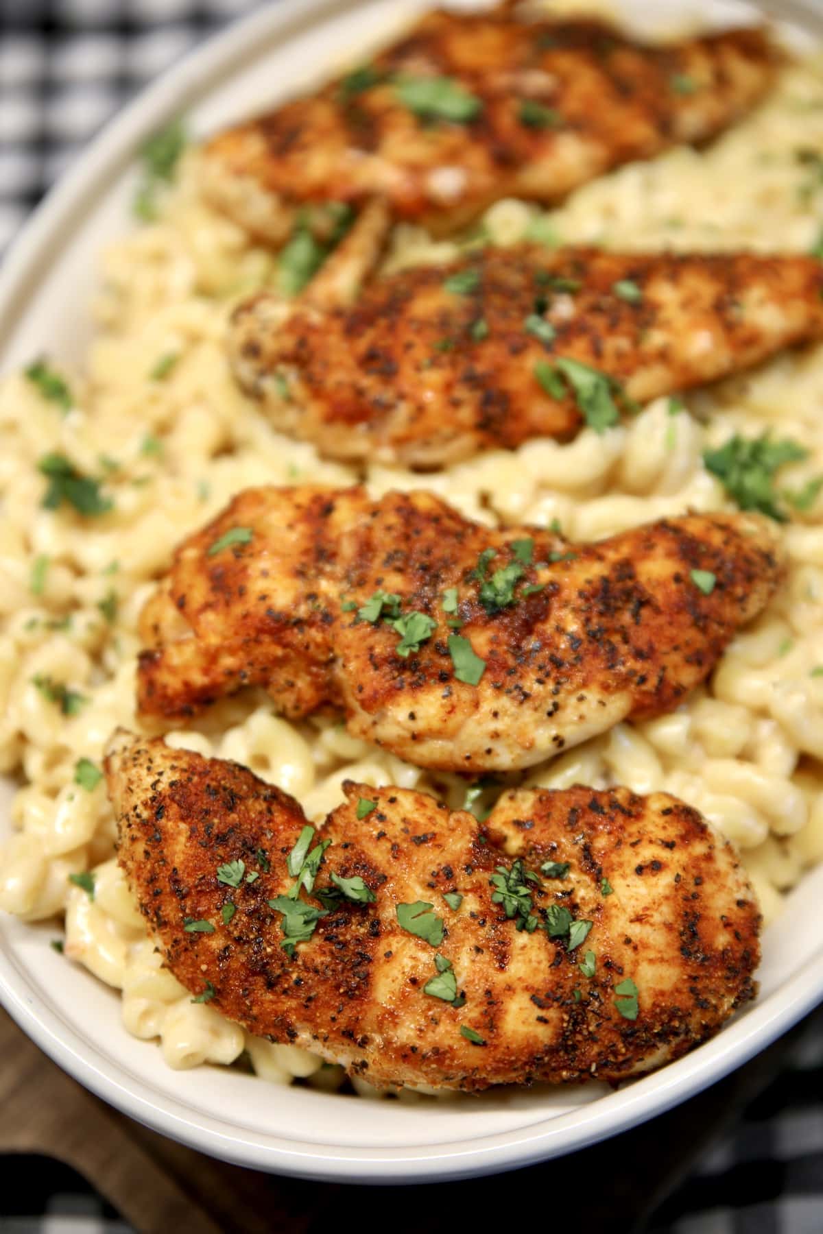 Chicken tenders with mac and cheese in a casserole.