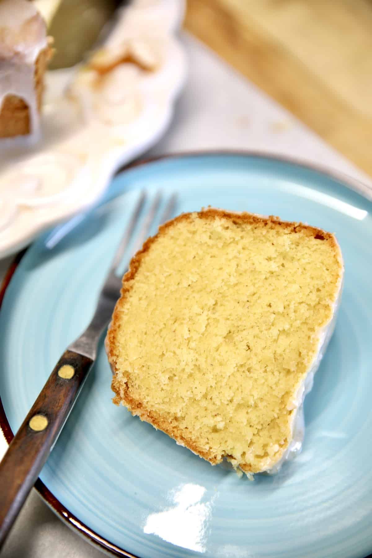 Cake slice on a plate with fork.