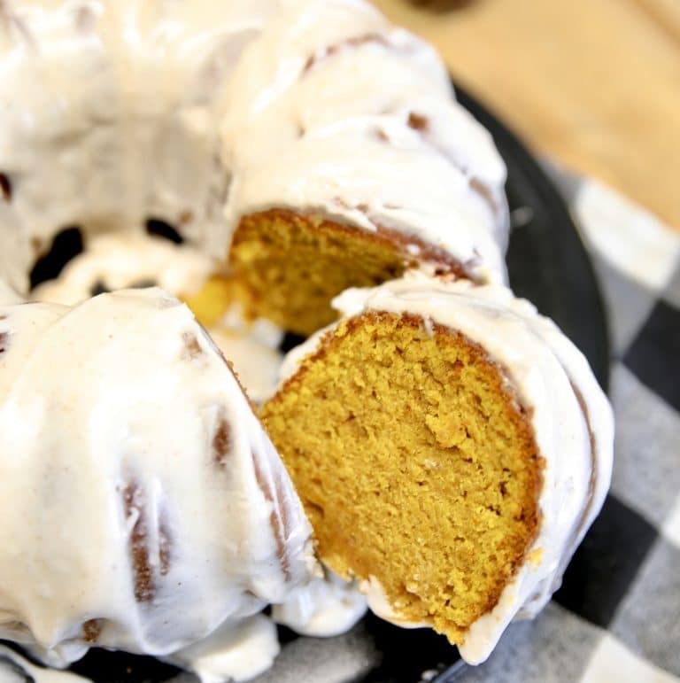 Pumpkin bundt cake with slice cut out.