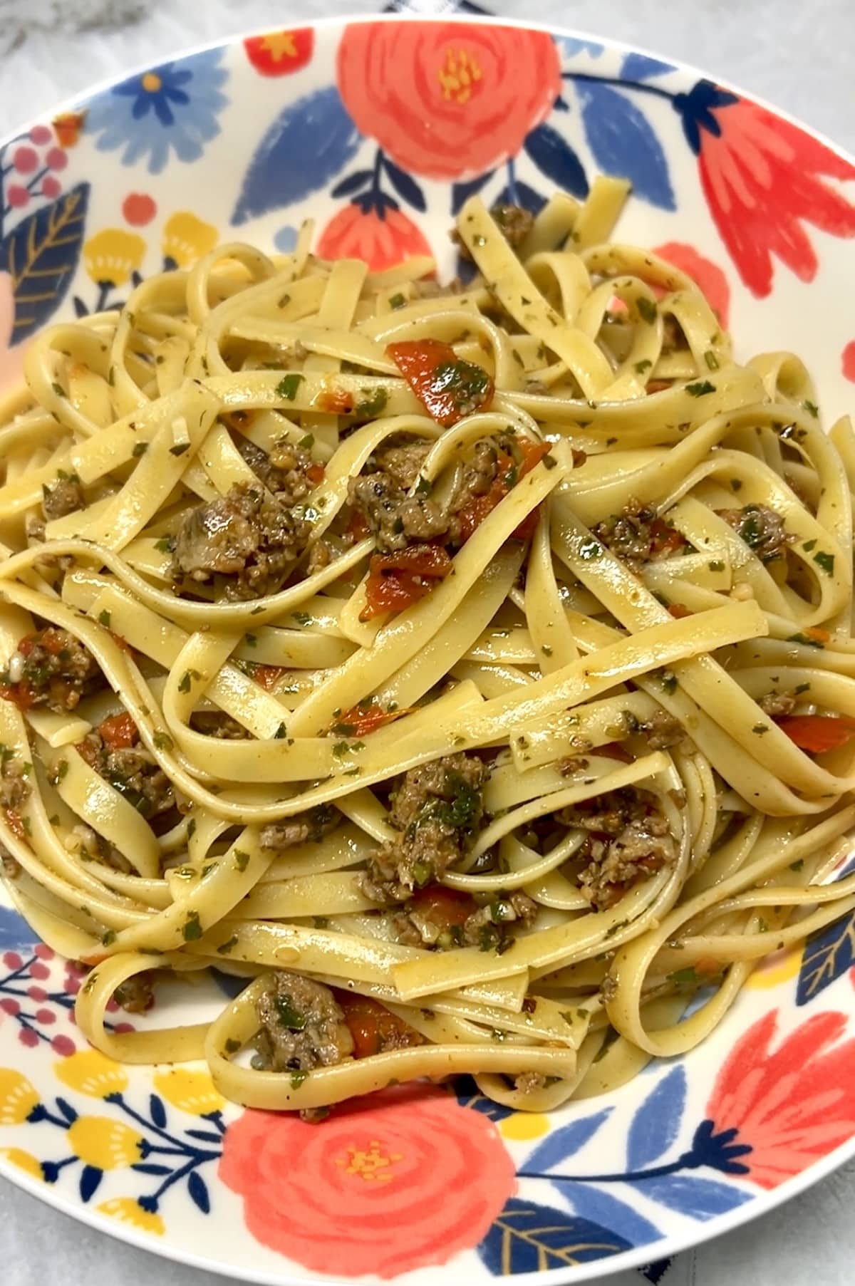 Bowl of sausage fettuccine pasta.