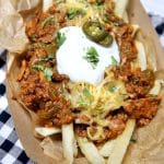 Chili cheese fries with sour cream and jalapenos.