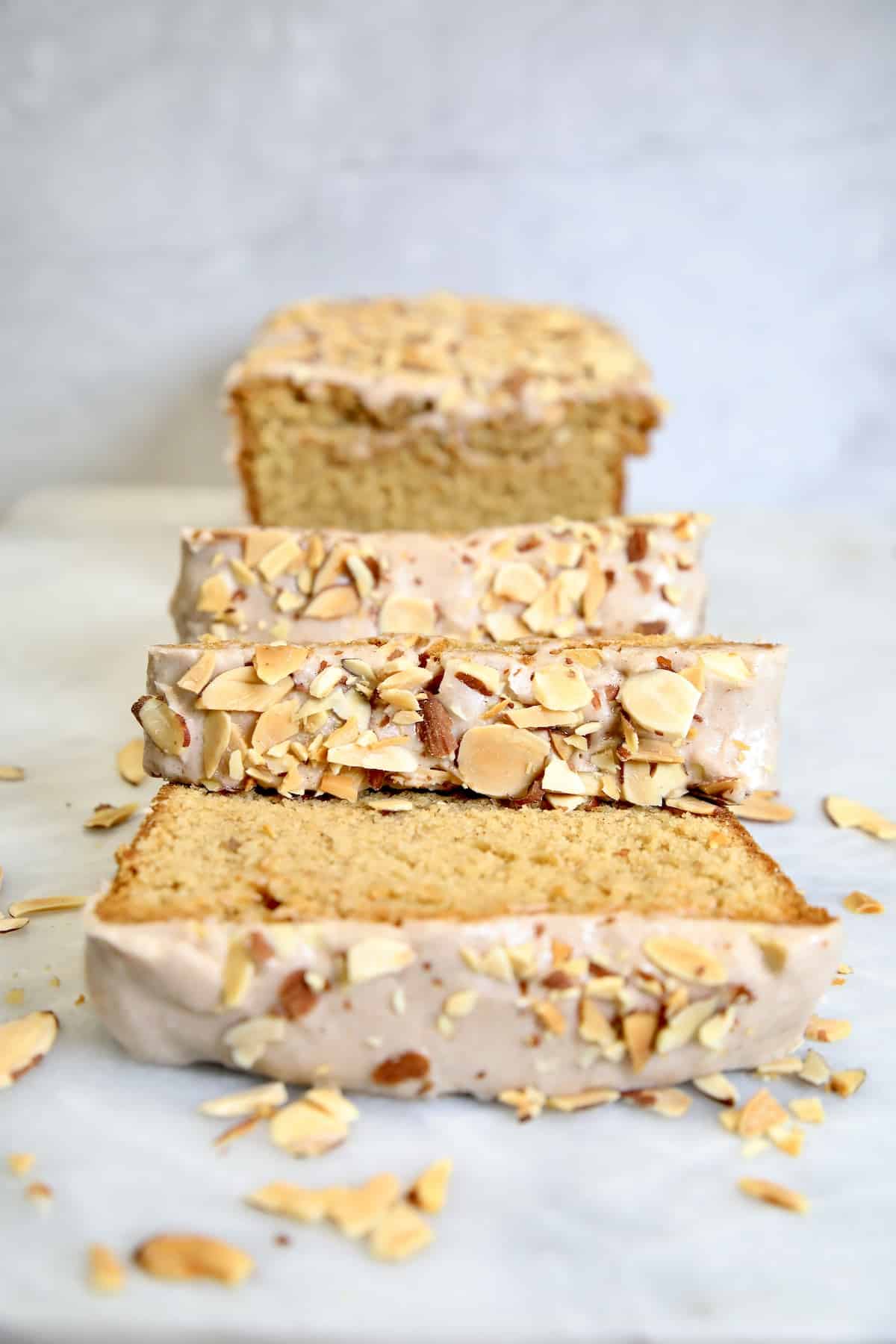 Sliced pound cake with sliced almonds.