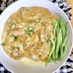 French onion chicken over mashed potatoes with green beans.