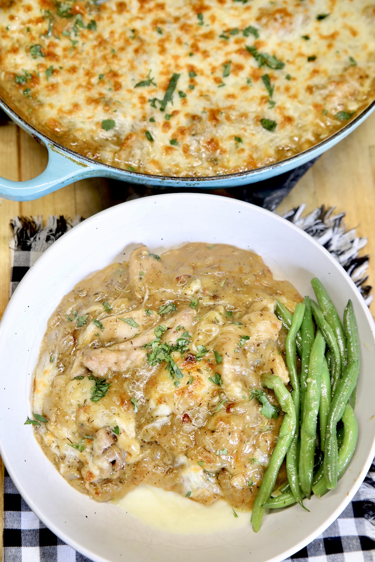 French onion chicken in a bowl with green beans + pan.