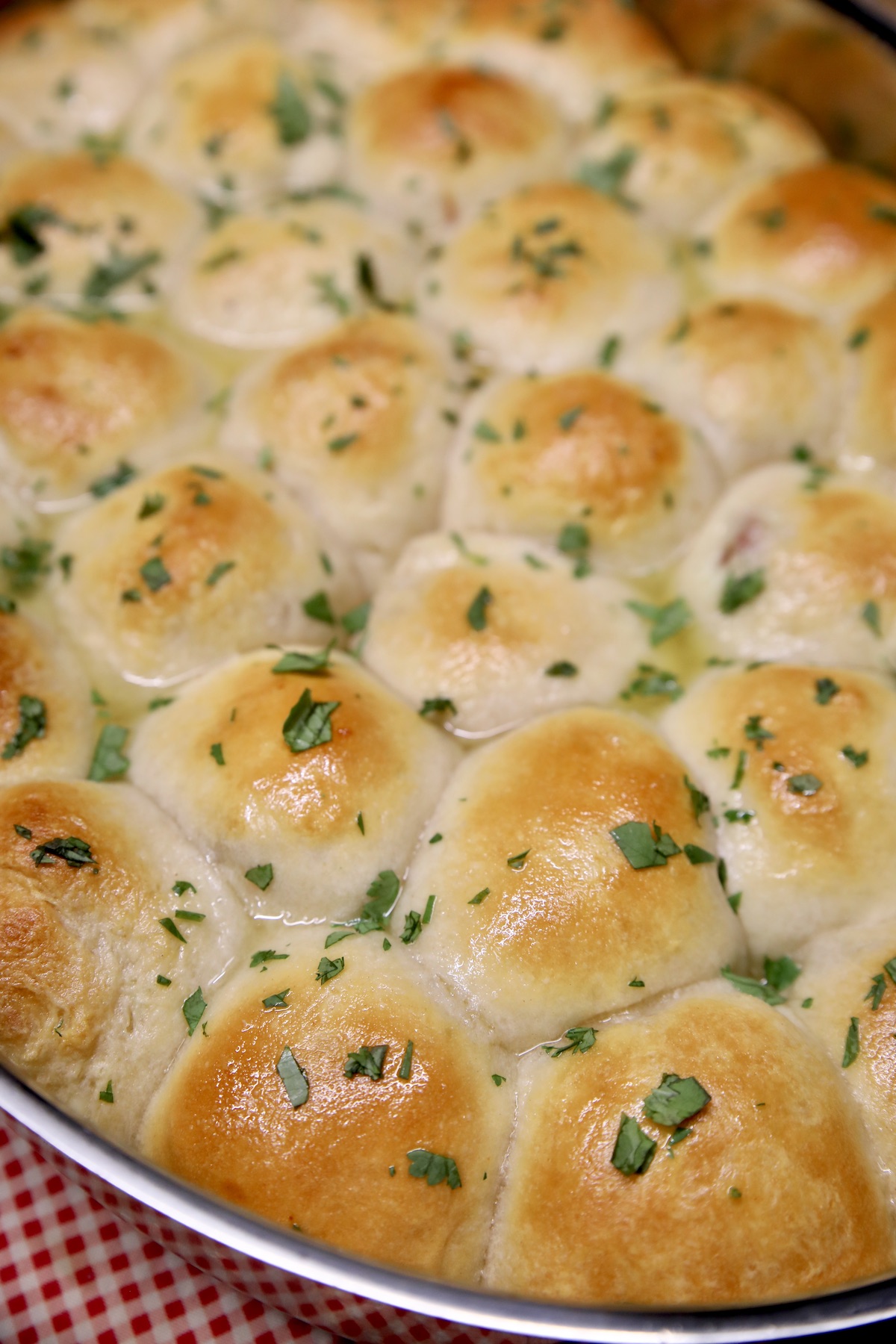 Ham and cheese stuffed biscuits in a pan.