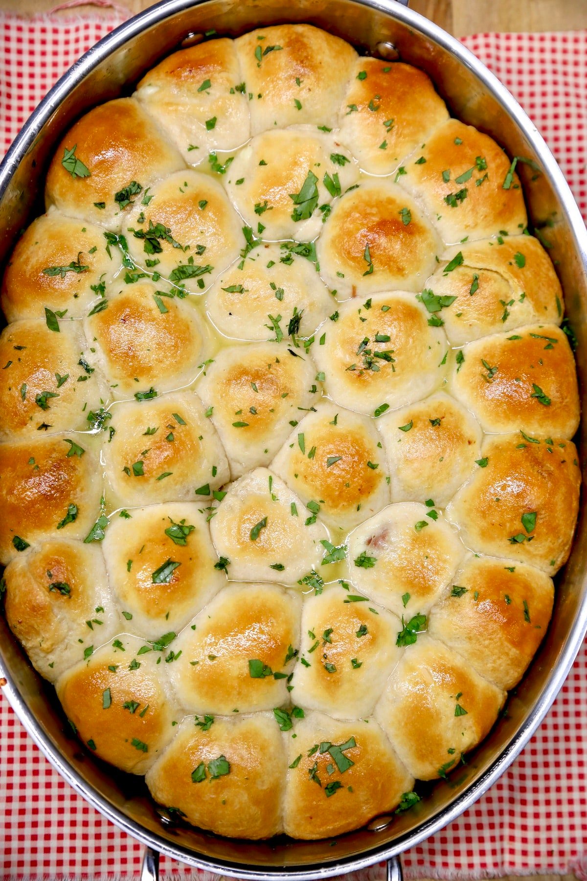 Pan of garlic butter stuffed ham and cheese biscuits.