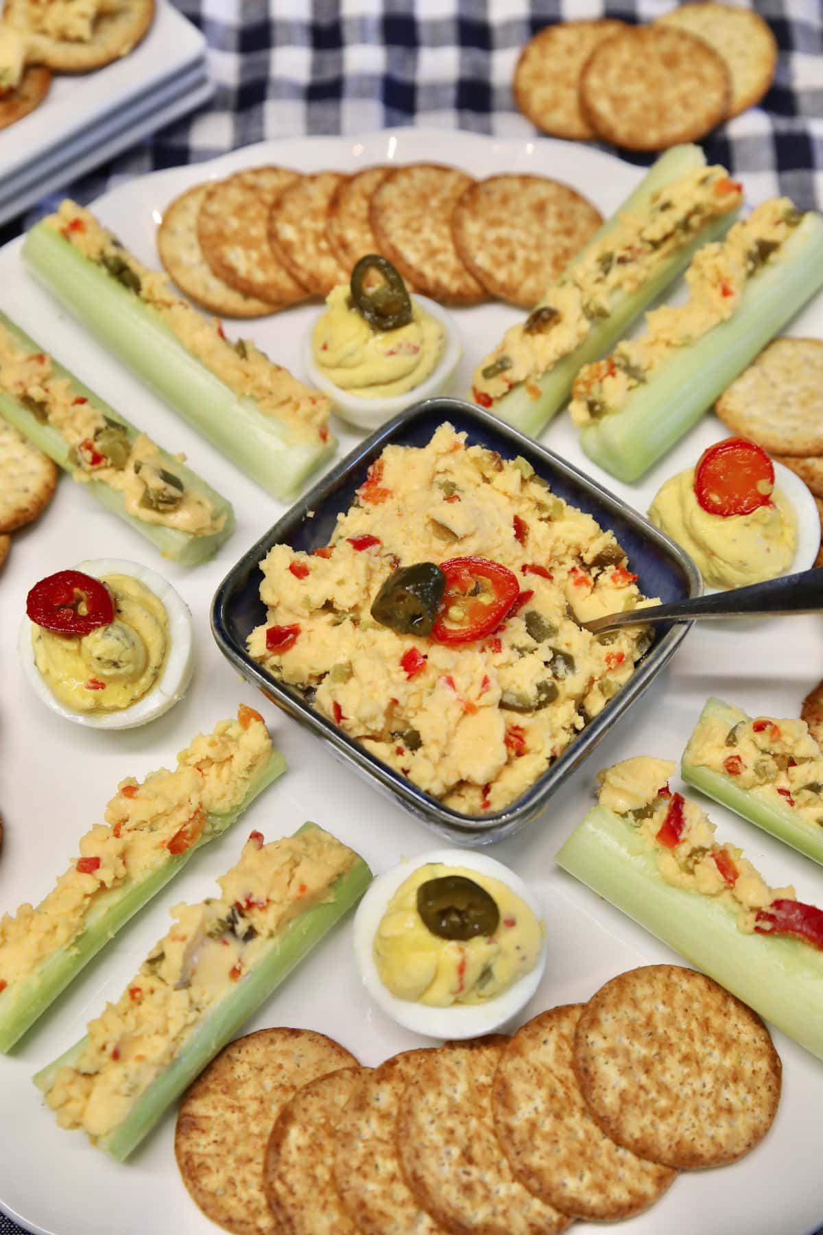 Platter of appetizers with jalapeno cheese spread.